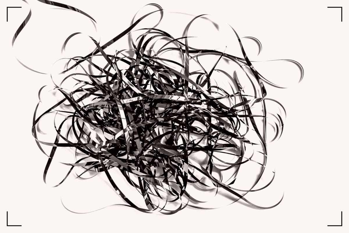 Old tape pulled out if its housing.