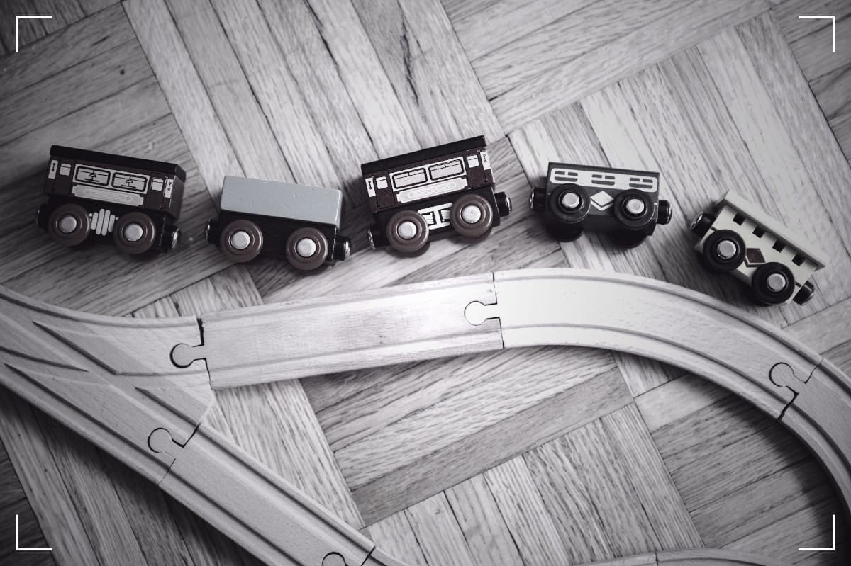 A wooden, toy train simmulating an accident.