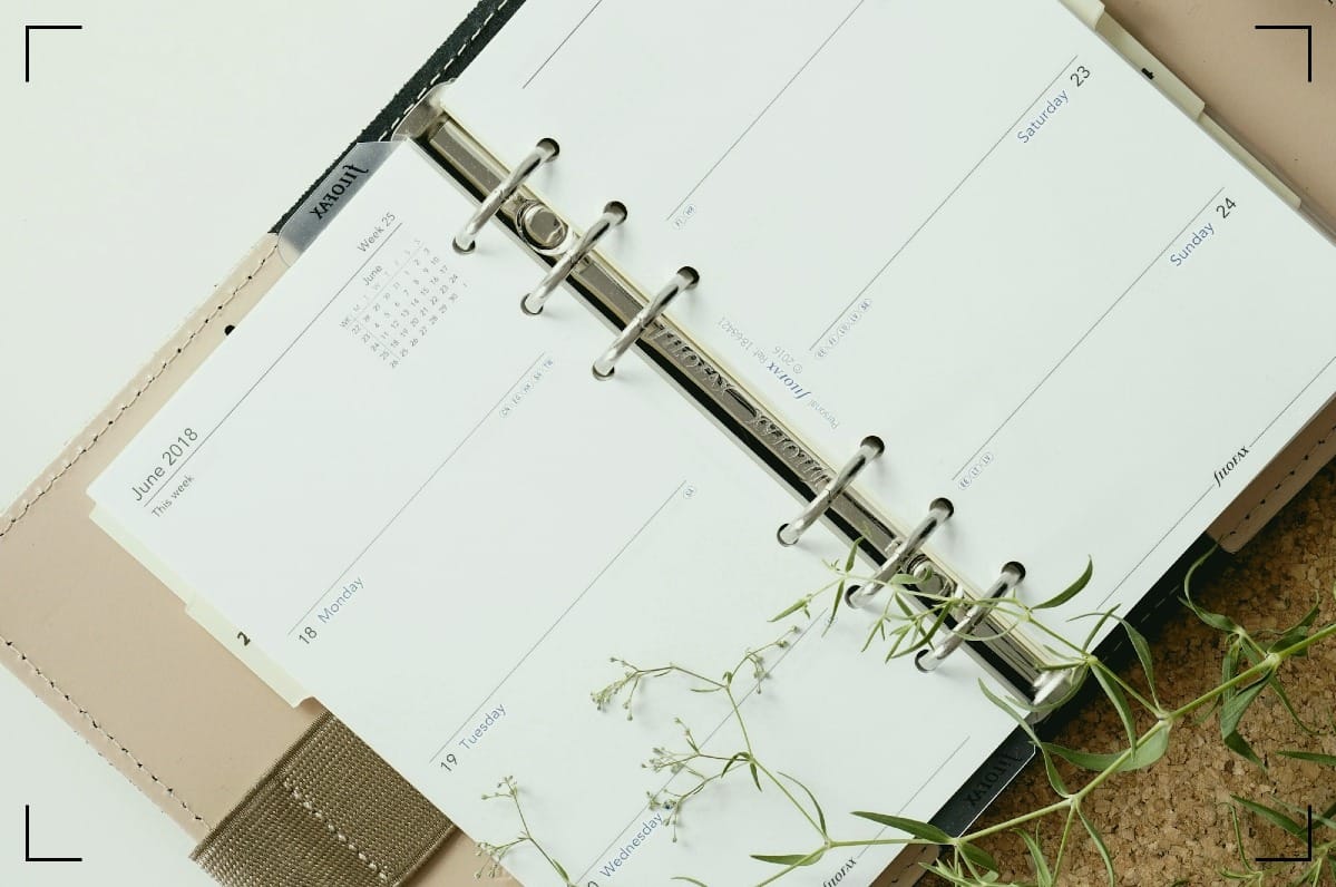 A Filofax lying open on the table.