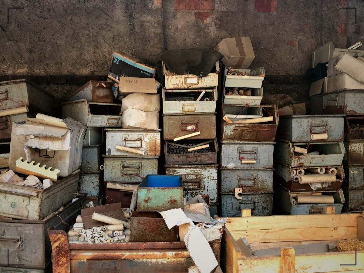 Rusty filing drawers piled on top of each-other.
