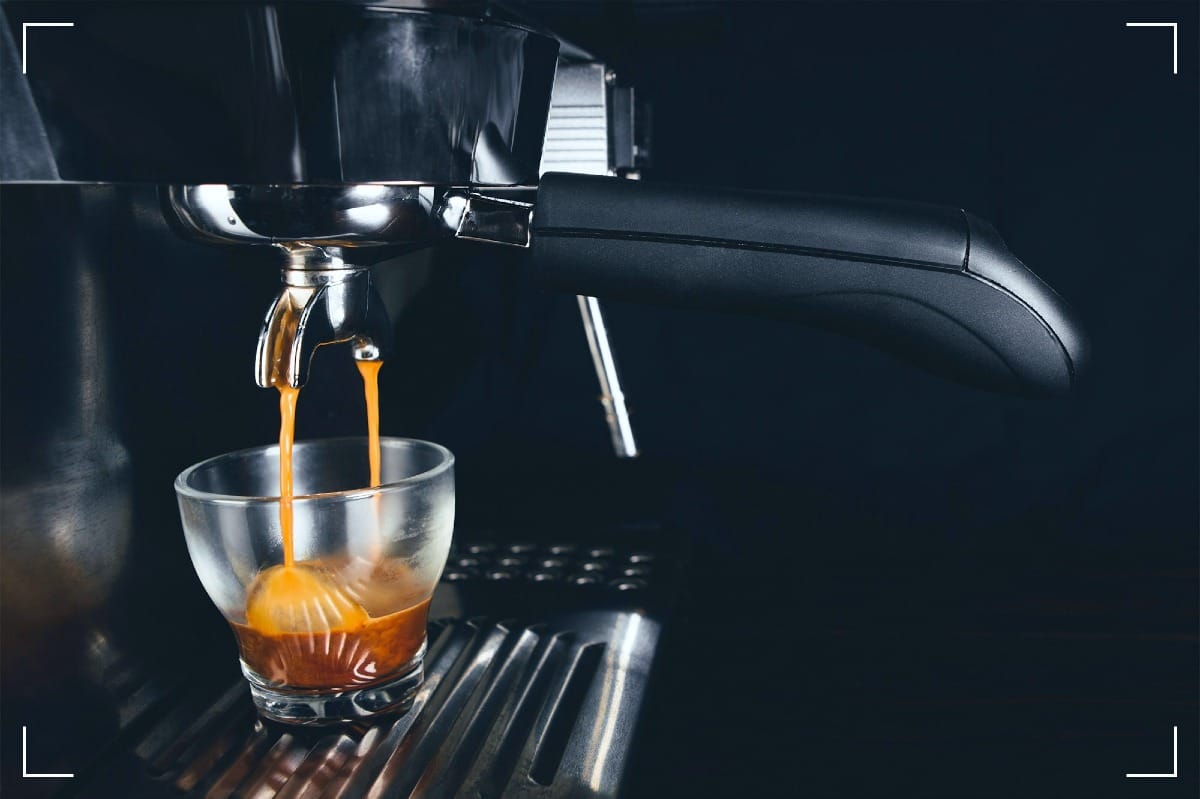 An espresson machine making a cup of coffee.