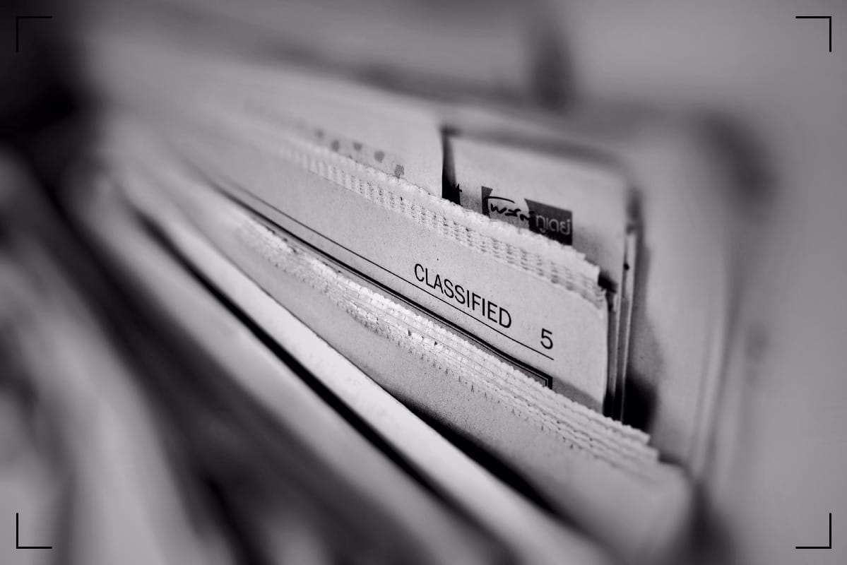 Close-up of pages from different newspapers.