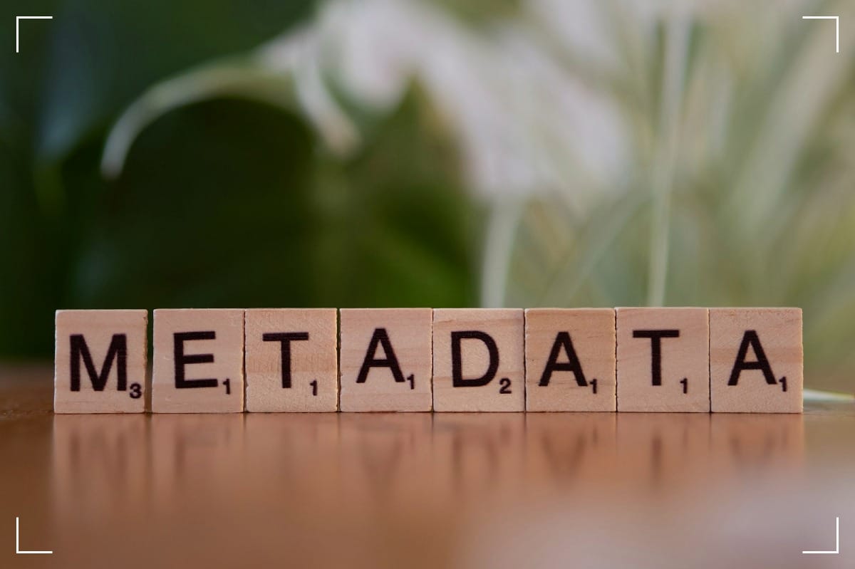 Wooden blocks from a Scrabble game reads: METADATA.