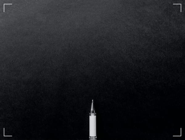 A pencil on a black background.