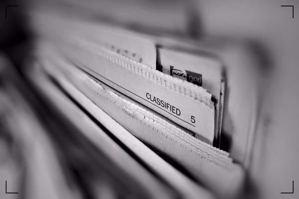 Close-up of pages from different newspapers.